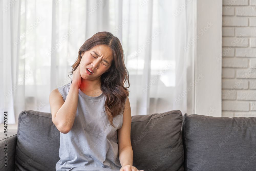Woman visibly experiencing neck pain suffering painful shoulder, Upper arm pain, office syndrome, muscles problem, musculotendinous strain, hurt, massage, possible muscle strain, tension or stiffness Woman visibly experiencing neck pain suffering painful shoulder, Upper arm pain, office syndrome, muscles problem, musculotendinous strain, hurt, massage, possible muscle strain, tension or stiffness