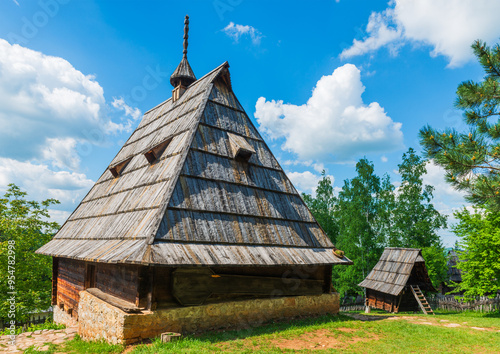 Old wooden houses in Serbian village. Rural landscape in summer