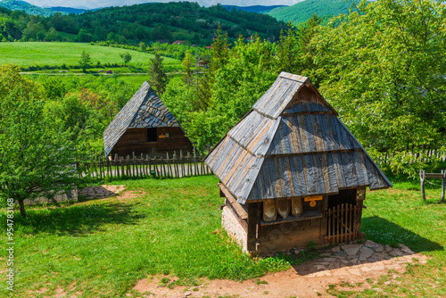 Old wooden houses in Serbian village. Rural landscape in summer