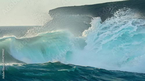 Waves Crashing Dramatically Against Rugged Cliffs with Spray Rising Into the Air