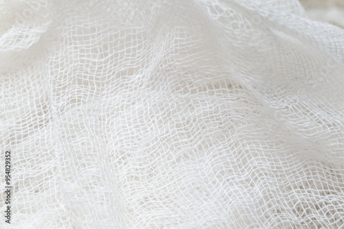 Close up white color muslin canvas cloth texture, white gauze folds, macro shot