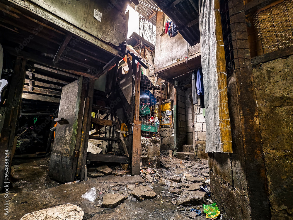 Metro Manila, Philippines - Aug 28, 2024: A typical squatter area in the city. A cramped slum area. Metro Manila, Philippines - Aug 28, 2024: A typical squatter area in the city. A cramped slum area.