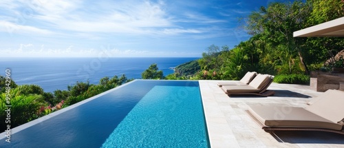 A private infinity pool overlooking a tropical paradise with luxury lounge chairs
