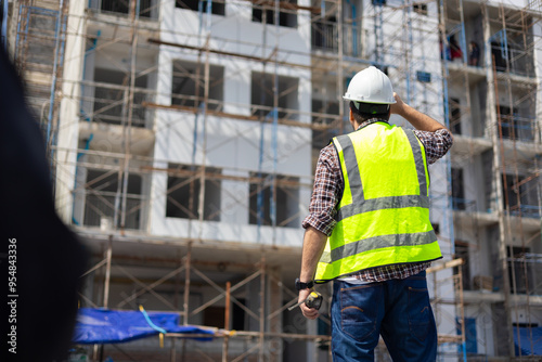 back view Engineering people, construction site. construction worker planning and architecture in construction site. Caucasian men