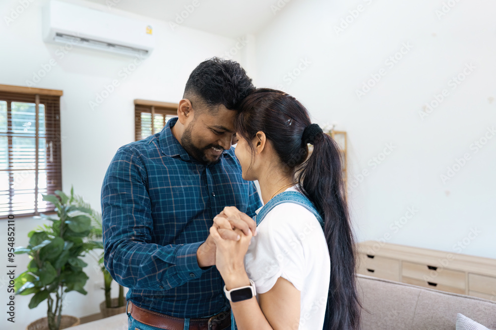 Happy Couple Dancing Together in Living Room with Natural Light and Modern Decor Happy Couple Dancing Together in Living Room with Natural Light and Modern Decor