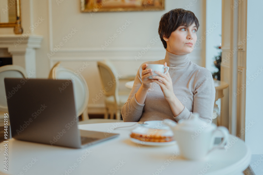 Woman is working on the pc at the internet cafe