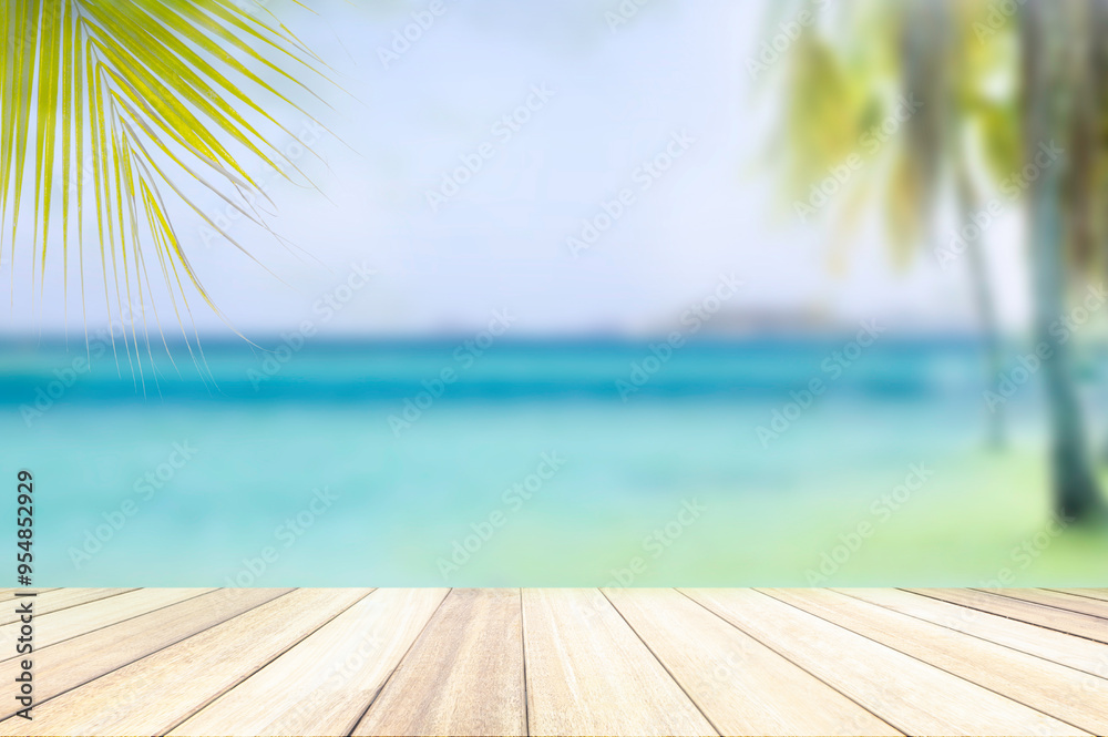 Fototapeta premium summer nature blur green paim leaf on tropical beach with blue bokeh sunset light background.Copy space for text about vacation trips surfing in the summer concept.Paradise of beach Asia.