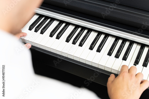 A person is playing a digital piano.