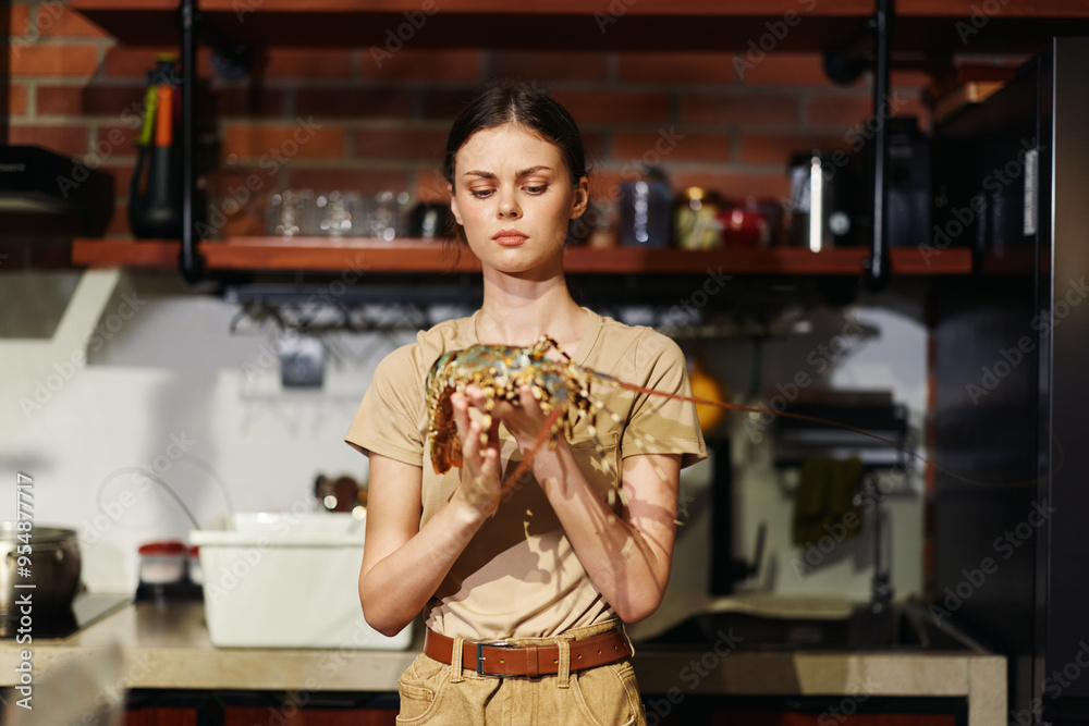 Young woman preparing lobster dish in a cozy kitchen with stove and oven in background Young woman preparing lobster dish in a cozy kitchen with stove and oven in background