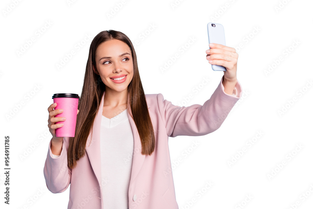 Portrait of cute cheerful lady using her cellphone making selfie holding mug with hot beverage wearing pink coat isolated over blue color background Portrait of cute cheerful lady using her cellphone making selfie holding mug with hot beverage wearing pink coat isolated over blue color background