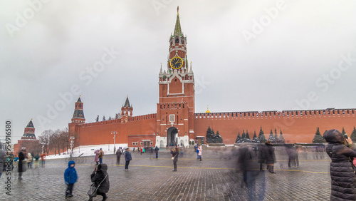 View of The Saviour Spasskaya Tower timelapse hyperlapse and Kremlin walls of Moscow Kremlin, Russia at day in winter.