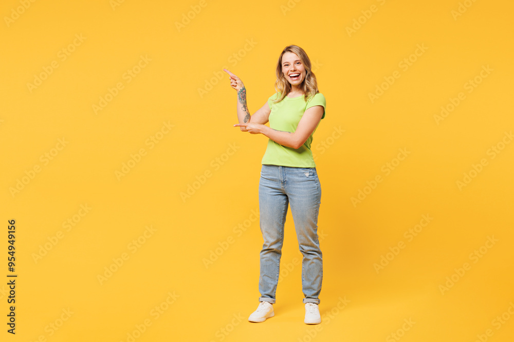 Full body young happy cheerful blonde woman she wear green t-shirt casual clothes point index finger aside on area mock up isolated on plain yellow orange background studio portrait Lifestyle concept Full body young happy cheerful blonde woman she wear green t-shirt casual clothes point index finger aside on area mock up isolated on plain yellow orange background studio portrait Lifestyle concept