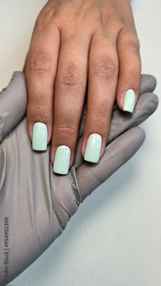 The beauty of the natural nails. Perfect clean manicure. New trendy nail arts on young women hand. Beautiful nail polish in hand