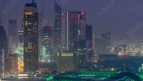 Dubai Downtown night to day timelapse. Aerial view over big futuristic city by night. photo