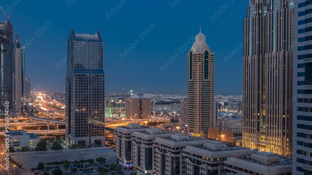 Naklejka premium Dubai downtown skyline night to day timelapse and Sheikh Zayed road traffic, UAE