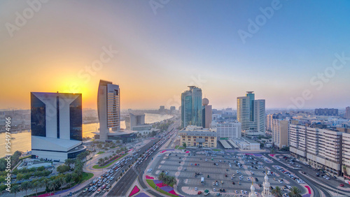 Dubai creek landscape at sunset timelapse with boats and ship near waterfront photo