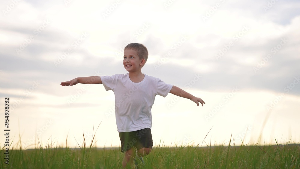 Boy and son running in nature. Father dad smile concept. A kid runs on the grass in a park. A boy and his son run through the lifestyle grass in a park. Boy and son running in nature. Father dad smile concept. A kid runs on the grass in a park. A boy and his son run through the lifestyle grass in a park.