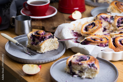 cinnabon buns with cheese cream and raspberries and blueberries