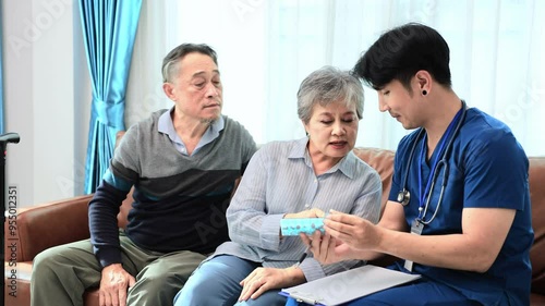 Senior couple get medical service visit from caregiver nurse at home while explaining on doses of vitamins and drug pill for health care and pension welfare insurance