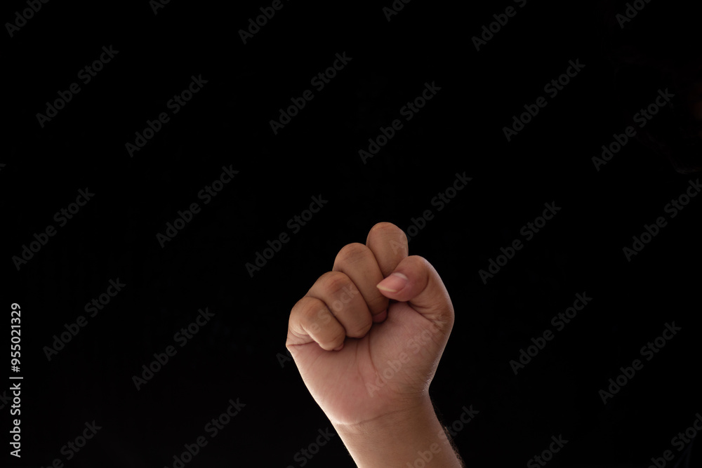 Close-up of clenched fist showing passion or strength. Photo isolated on black background Close-up of clenched fist showing passion or strength. Photo isolated on black background