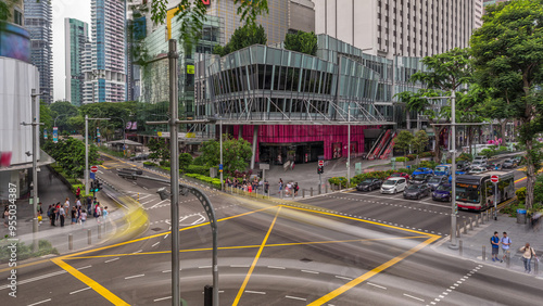 Aerial view of sidewalk and intersection of Orchard road in Singapore timelapse hyperlapse.