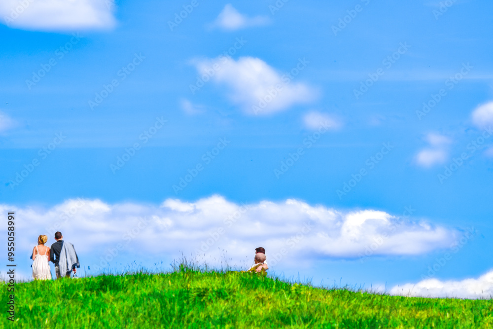 Family relaxing on the meadow in summer Family relaxing on the meadow in summer