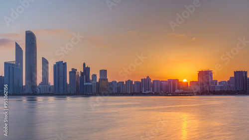Wallpaper Mural Abu Dhabi city skyline on sunrise time with water reflection timelapse. Torontodigital.ca