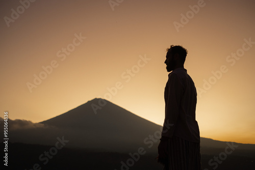 Silhouette of a Man Admiring a Majestic Mountain at Dawn, Capturing the Spirit of Freedom and Adventure.