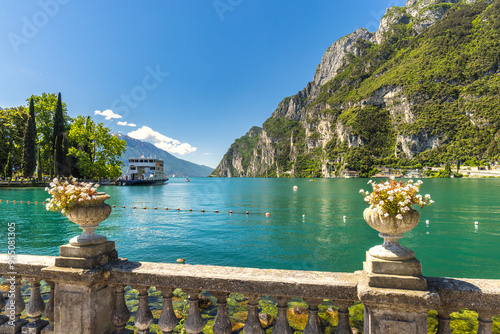 Fototapeta Naklejka Na Ścianę i Meble -  Lake Garda with mountains in background, view from Riva del Garda town shore, Italy, Europe.
