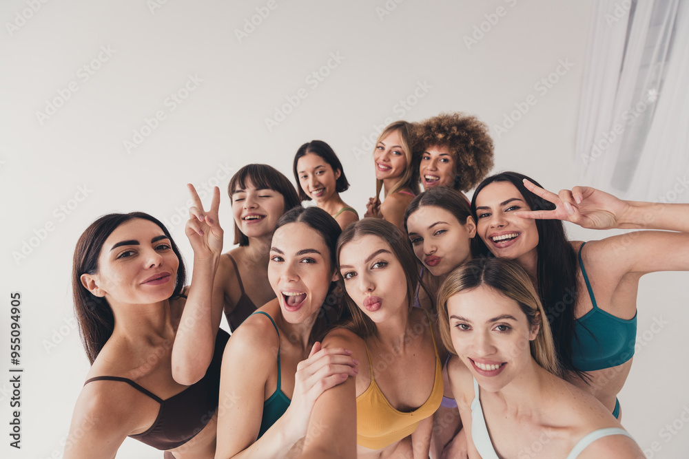 Fototapeta premium No filter studio photo of pretty funny women wear bras hugging tacking selfie showing v-sign isolated beige color wall background