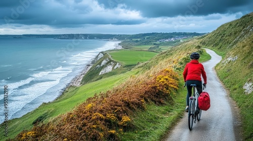 A person cycling along a coastal path