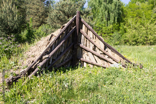 A charcoal pile (charcoal clamp) a carefully arranged pile of wood to produce charcoal, photo taken in Snina, Slovakia