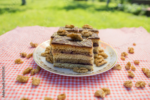 Gerbeaud cake also called Zerbo Rez in Slovakia and Czechia or zserbó szelet in Hungary served on small table outside photo