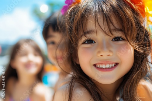 Three smiling children with flowers in their hair, enjoying a sunny day outside, Perfect for use in family, summer, happiness, and vacation themes,