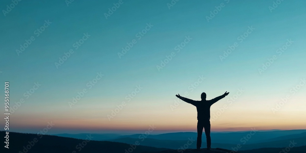 Fototapeta premium Silhouette of a Person at Sunset: Embracing Freedom and Repentance in a Majestic Mountain Landscape, with a Glowing Sky and Expansive Evening Shadow, Christian worship God in hope concept.