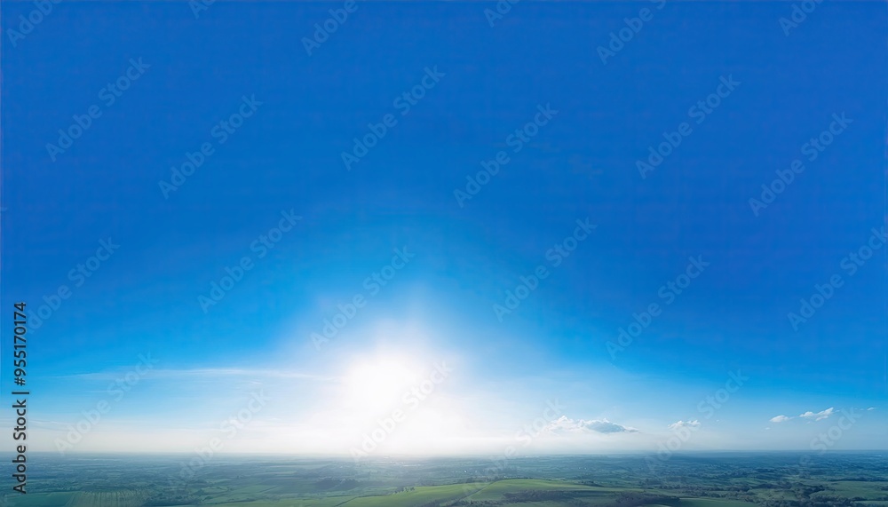 Fototapeta premium clear blue sky with with no clouds. The sky is very bright and the sun is shining
