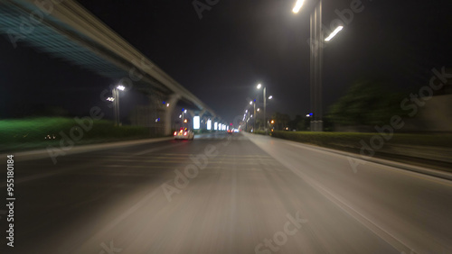 Road and tunnel on the Palm Jumeirah island in Dubai at night, UAE timelapse