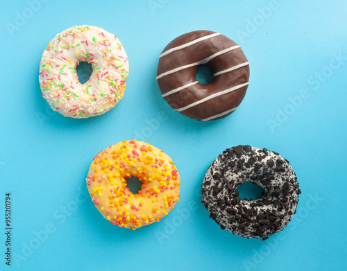 Doughnuts, Chocolate Brown and Pink Donut with Multicolored Sprinkles photo