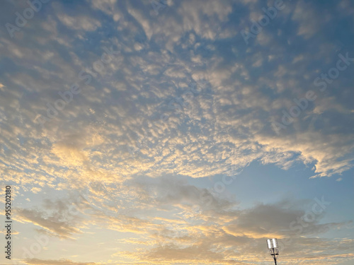 Beautiful cloudy sky view with goldensunlight.