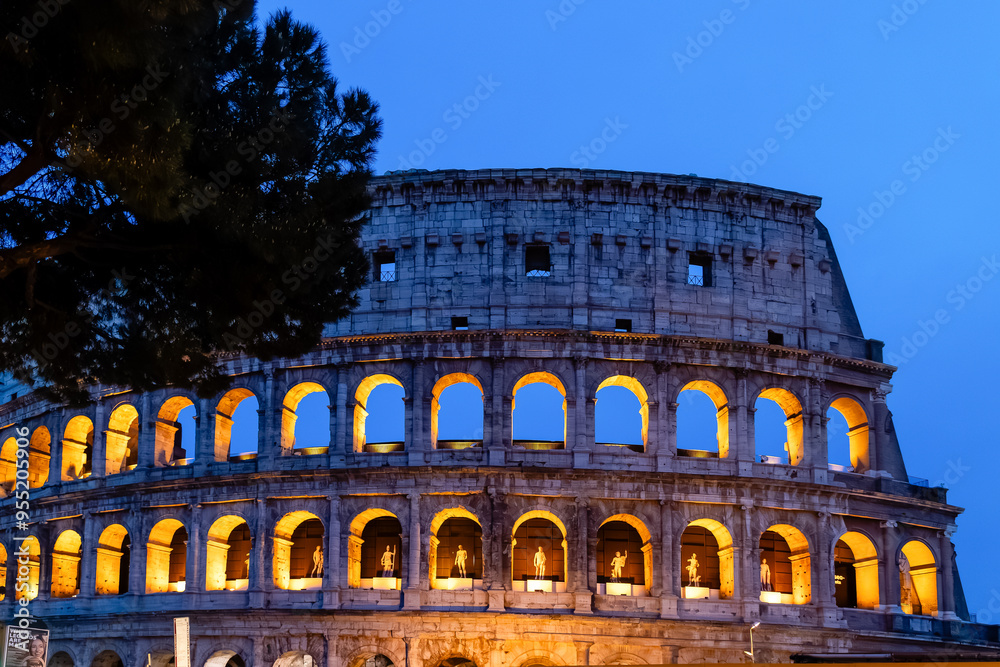Obraz premium Rome, Italy - April 09, 2024: View of the Roman Coliseum in Rome with tourists crowding its surroundings in Rome, Italy