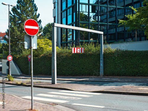 A road that leads into the tunnel, with a warning sign and marking that only a certain height of vehicle can pass through