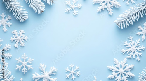 Pastel blue Christmas background with delicate snowflakes and a large area for personalized greetings