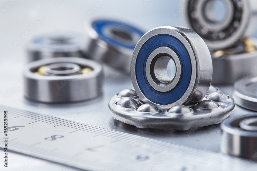 different bearings on a metal background. Part of mechanism. different bearings on a metal background. Part of mechanism.