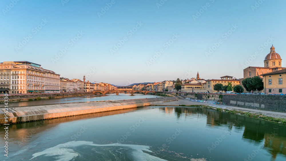 Obraz premium Sunset skyline timelapse view of Tuscany City, Housing, Buildings and Ponte alla Carraia and Arno River, Florence, Italy.