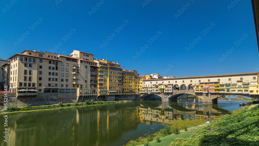 The Ponte Vecchio on a sunny day timelapse hyperlapse, a medieval stone segmental arch bridge over the Arno River, in Florence, Italy The Ponte Vecchio on a sunny day timelapse hyperlapse, a medieval stone segmental arch bridge over the Arno River, in Florence, Italy