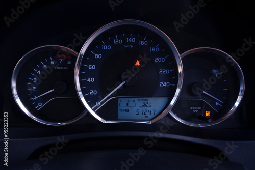 The console panel displays the car's information and speed and the fuel gauge is red.