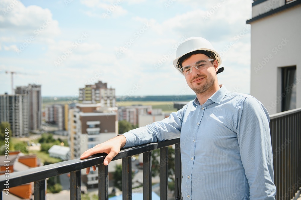Businessman standing in building in construction process Businessman standing in building in construction process