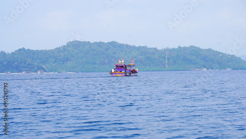 Lampung, Indonesia 2nd June 2024 : kind of transportation for tourists who want to dive at pahawang island photo