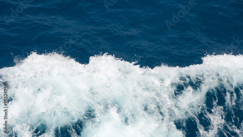 Aerial view to ocean waves. Blue water background photo