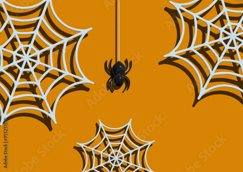 Halloween themed background with hanging spider and spider web